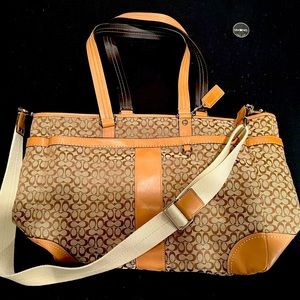 Tan carry on bag with shoulder strap